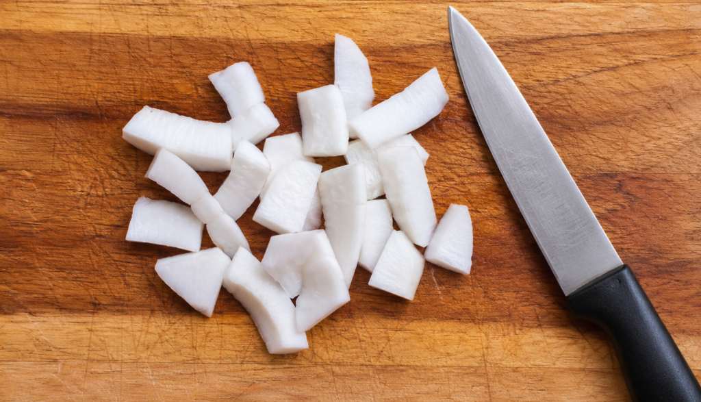 ChatGPT Image Jun 14, 2026, 06_45_56 PM Small portion of fresh coconut flesh pieces on wooden cutting board